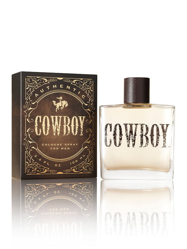 Cowboy cologne spray bottle and packaging on a white background
